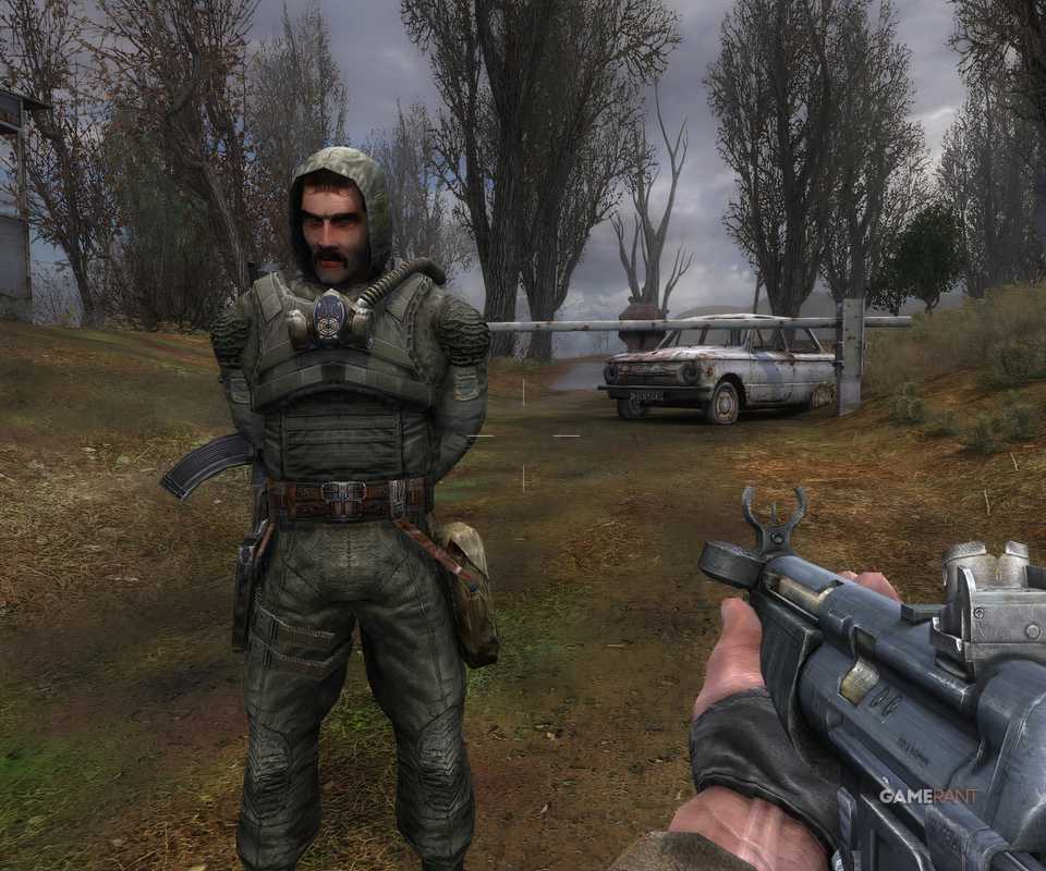 8 Best Games Set in a Nuclear Wasteland, Ranked Holding a machine gun an NPC
