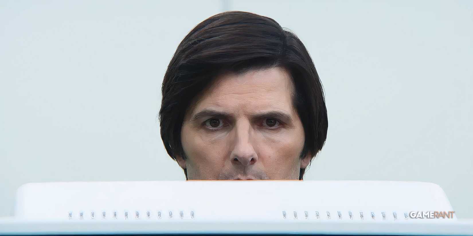 severance mark behind his computer