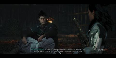 Kogoro sitting and talking to the player in Rise of the Ronin