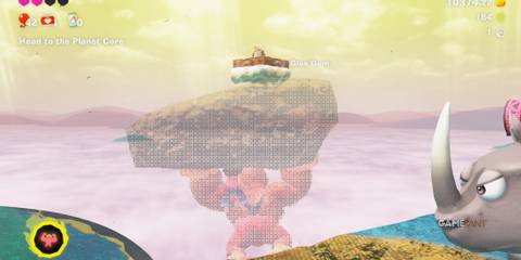 DK lifts a large rock aiming toward Cranky Kong’s cloud in Donkey Kong Bananza