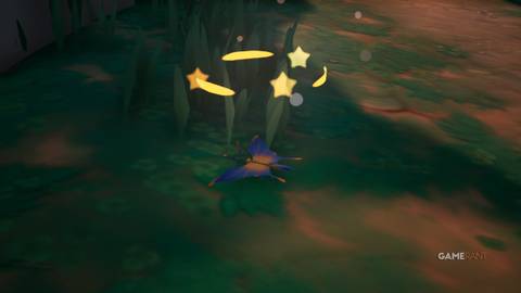 A Sunburst Batterfly lying on the ground after being stunned by a Sticky Smoke Bomb in Palia.