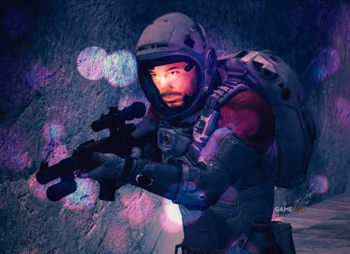 A Starfield character wearing a space suit and holding an assault rifle in a dark cave, with a faint bokeh effect visible in the foreground.