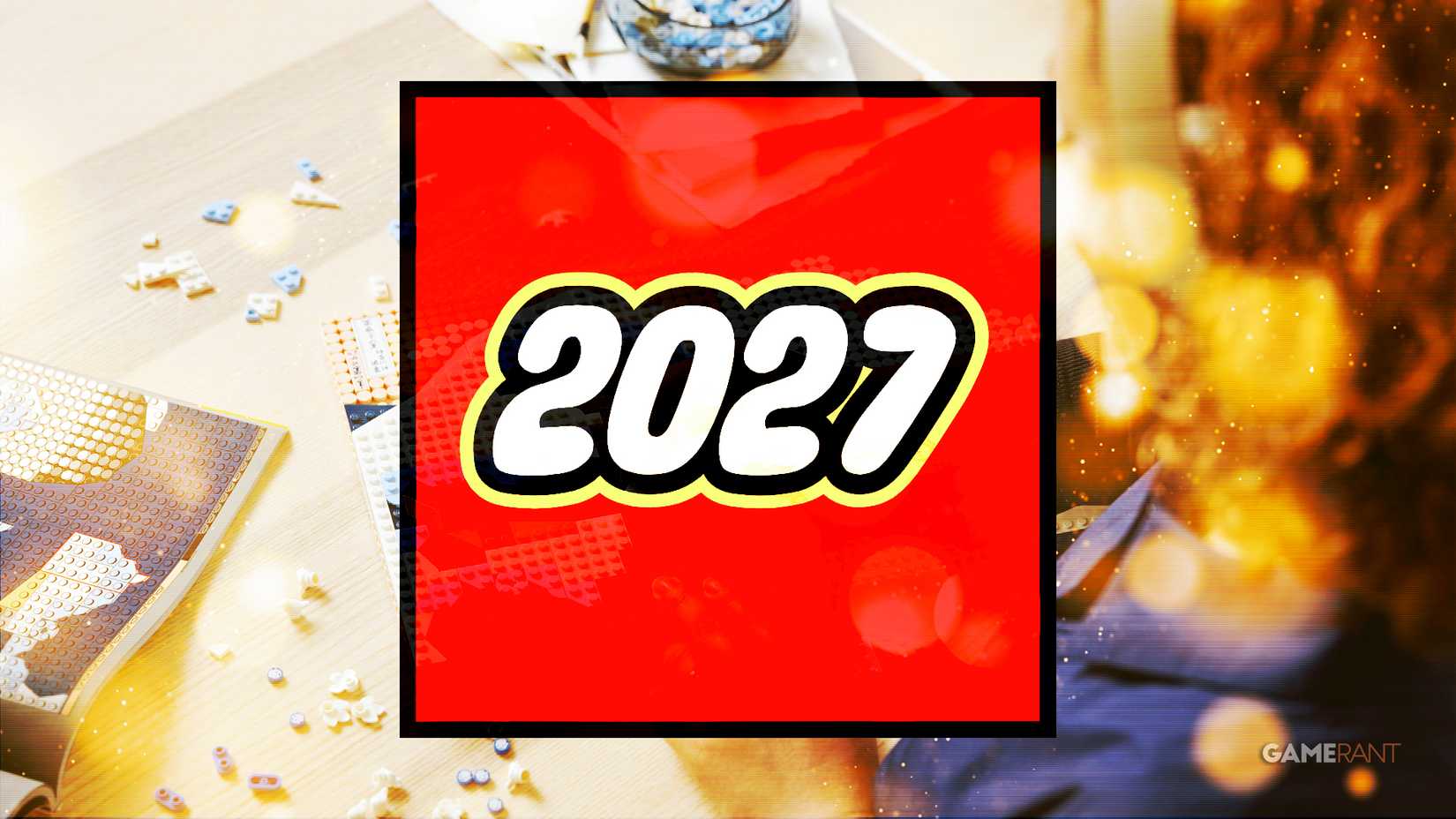 A semi-transparent LEGO-style 2027 logo rectangle in front of a shot of someone building the 31208 Hokusai - The Great Wave set.