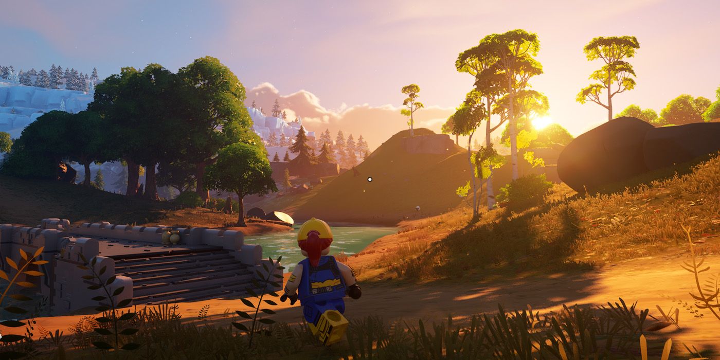 Screenshot from Lego Fortnite featuring a minifig running by a bridge and river